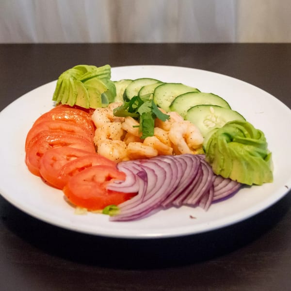 Ciros Sea & Mexican Food shrimp ceviche with tomatoes, cucumbers, avocado, and red onion.